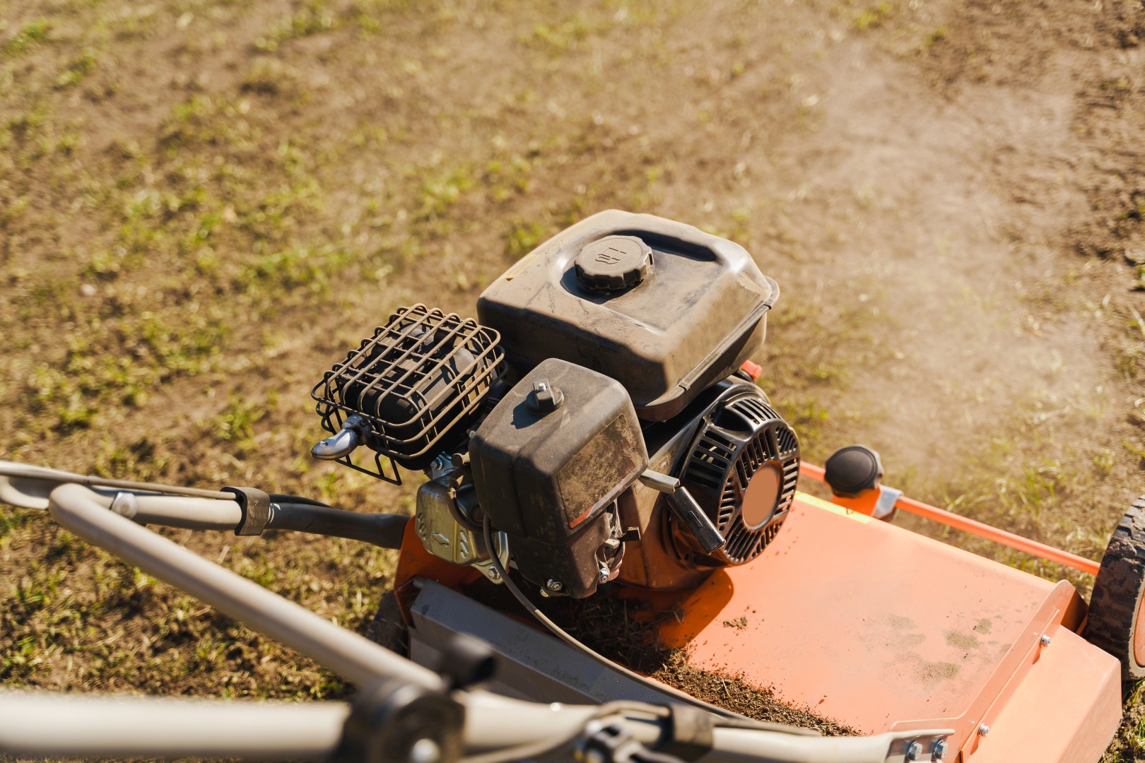 Close-up of a lawn motor in the meadow