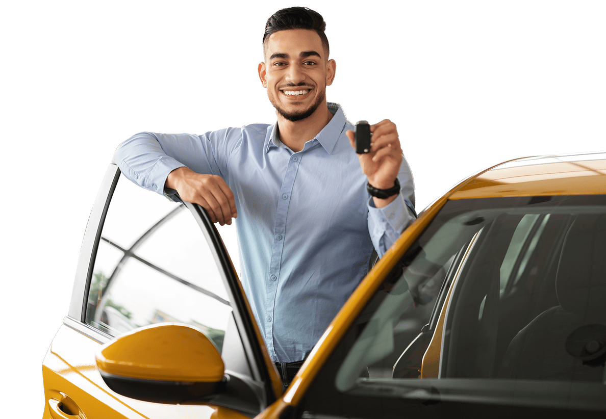 man standing outside of a yellow car holding the keys and smiling